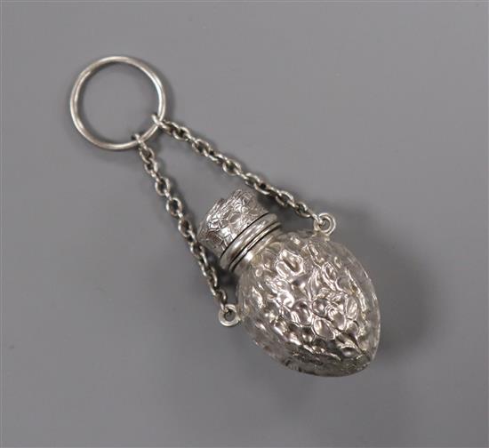 A late 19th/early 20th century novelty white metal scent flask, modelled as a walnut, unmarked, 39mm.